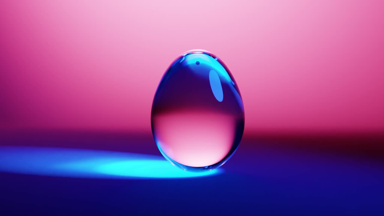 Goccia di liquido trasparente con riflessi cangianti di luce al neon