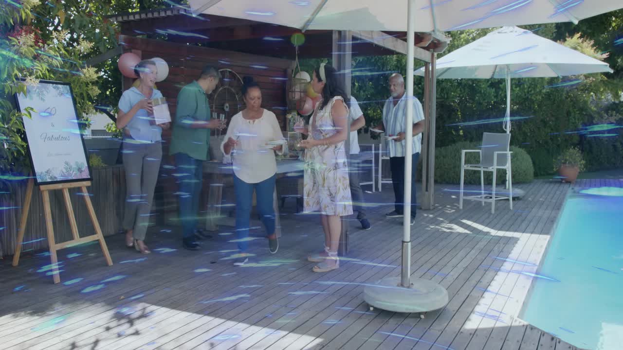 Men and women shaking hands, moving to serving table at event, picking cups, chatting beside pool