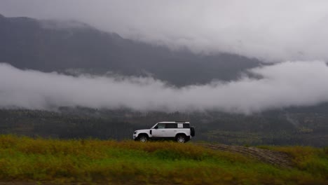 landrover defender offroad driving through mud