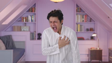 sick indian man having an heart attack