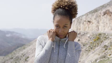 young sporty woman looking at camera