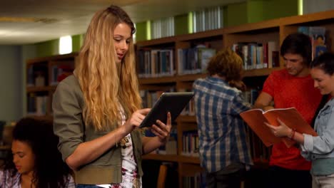 student using tablet in library