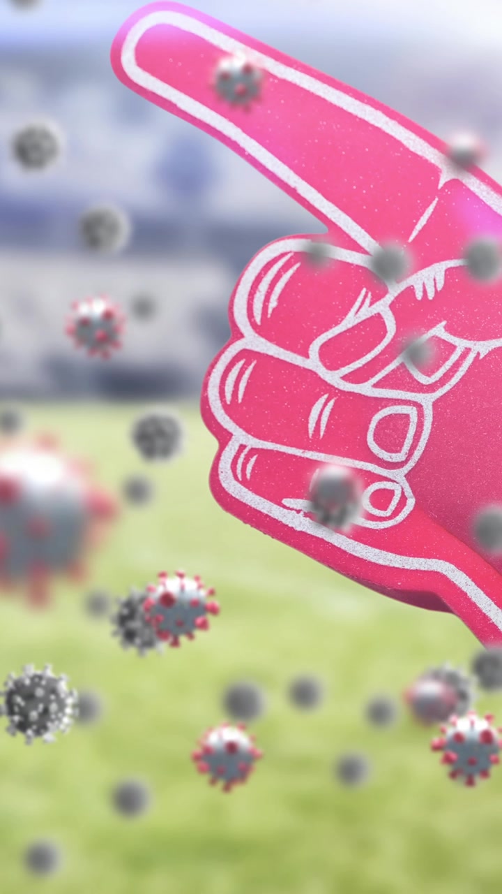 Animation of covid cells floating over warning sing