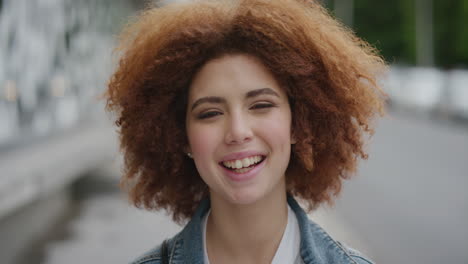 portrait-of-cute-young-mixed-race-woman-laughing-cheerful-enjoying-happy-student-lifestyle-in-urban-city-cute-female-funky-afro-hairstyle-real-people-series