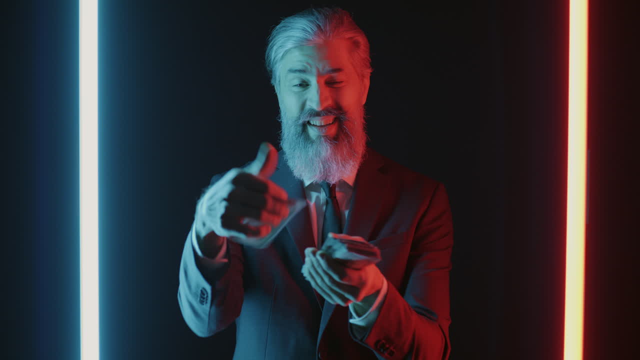 Smiling Businessman Displaying Money Under Neon Lights