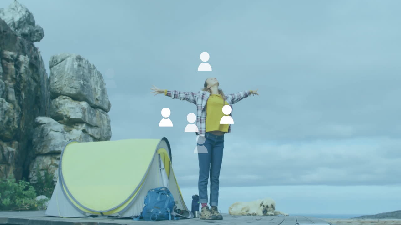 Woman stretching arms wide on wooden pier near cliff, showcasing animated fitness stats and icons