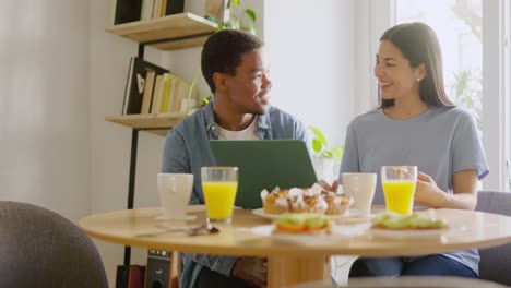 a couple enjoying breakfast together at home