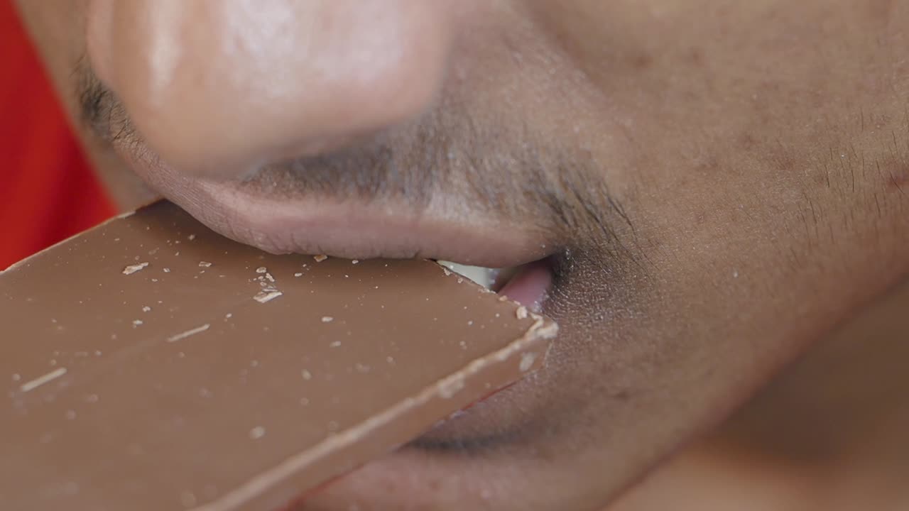 Person eating chocolate