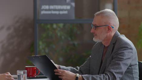 woman speaking with senior hr manager on job interview