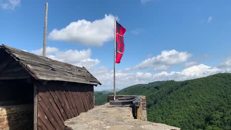 Knight-Flag-waving-on-top-of-medieval-german-castle-tower