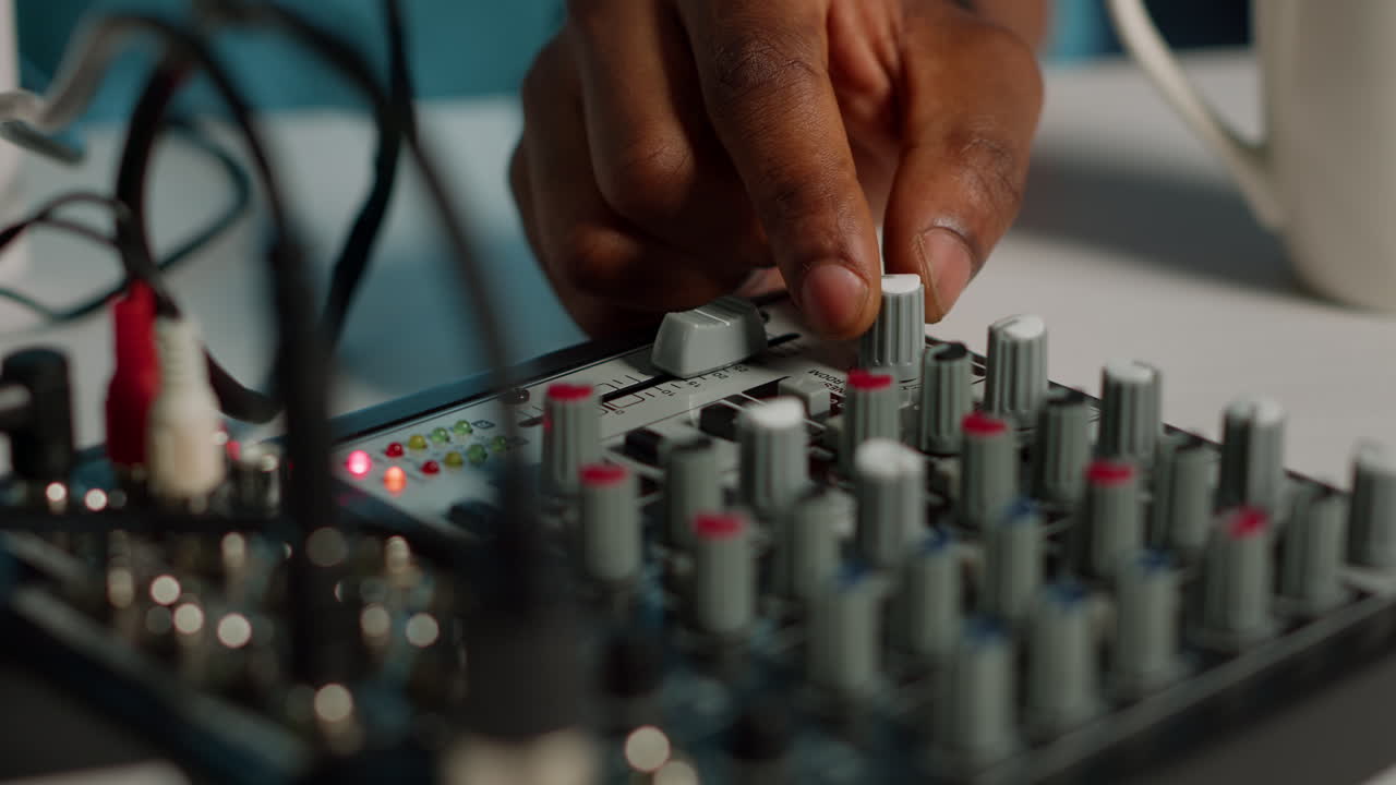 Close up of person using podcast equipment board for video