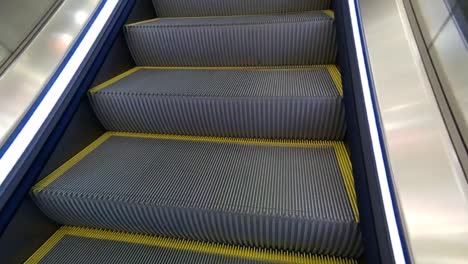 metal escalators leading to the top