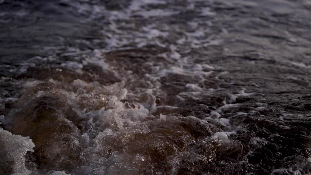 Boat wake creating waves in the sea