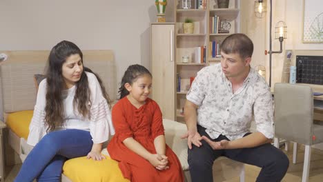 father and mother giving advice to their daughters.