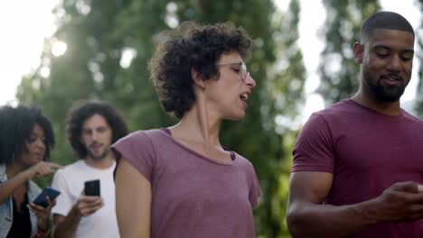 smiling multiracial couple having pleasant conversation