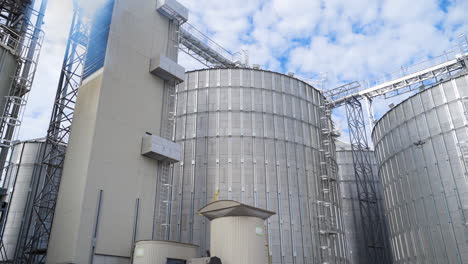 exterior of modern industry. large grain elevators for storing and processing agricultural products. innovative hangar premises of a factory.