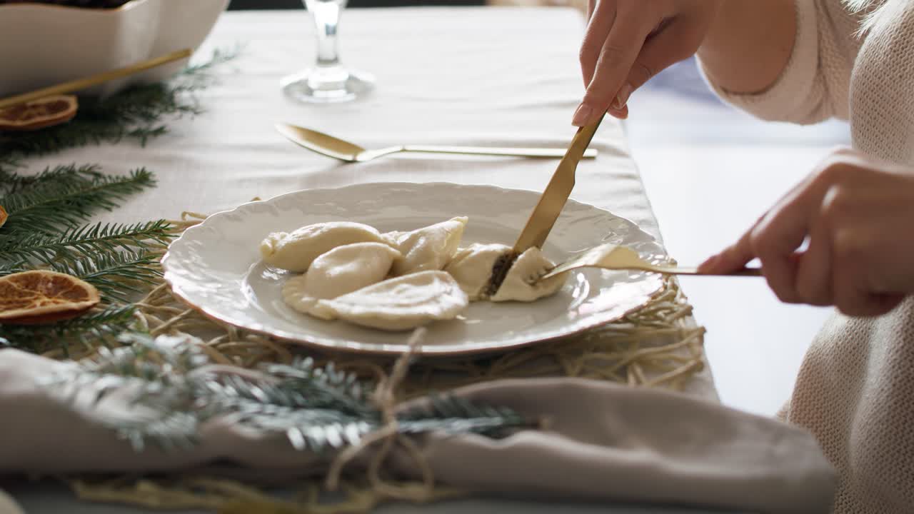 Woman eating dumplings at the Christmas Eve