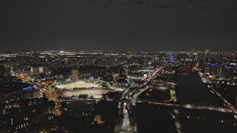 NYC-New-York-Aerial-v272-drone-flyover-Highbridge-in-Bronx-capturing-Harlem-river-bridge-crossing,-riverside-traffic-and-Upper-Manhattan-cityscape-at-night---Shot-with-Inspire-3-8k---September-2023