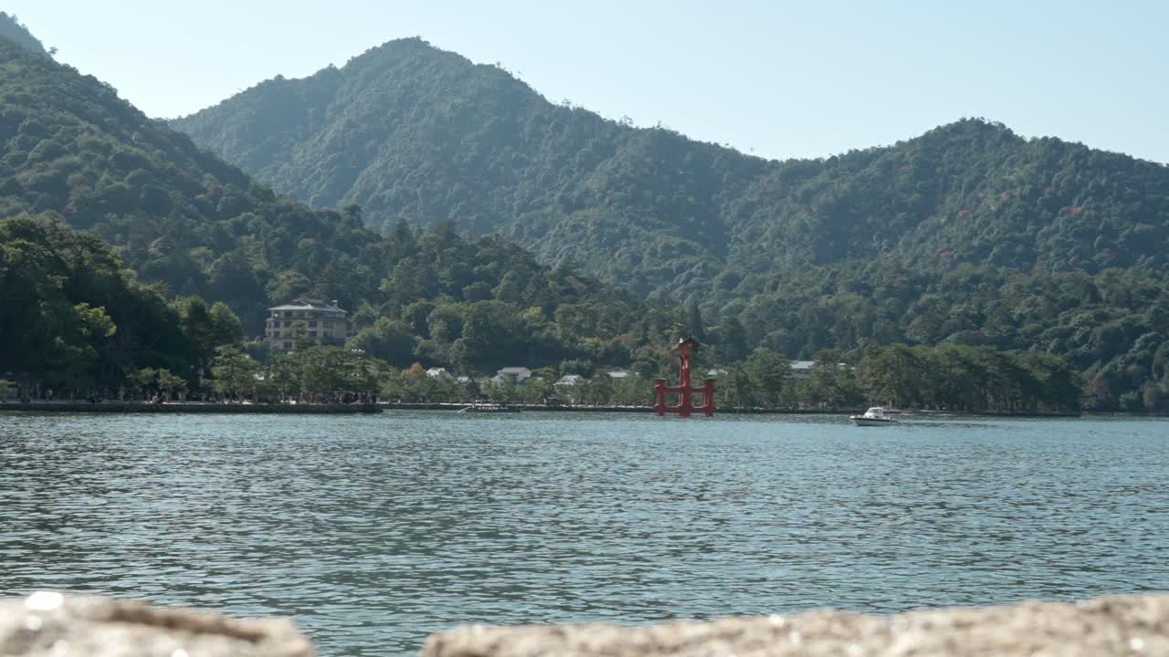 Itsukushima Jinja's torii gate on Miyajima Island presents a scene of spiritual and natural harmony, where Hiroshima’s cultural heritage meets the quiet beauty of the sea.