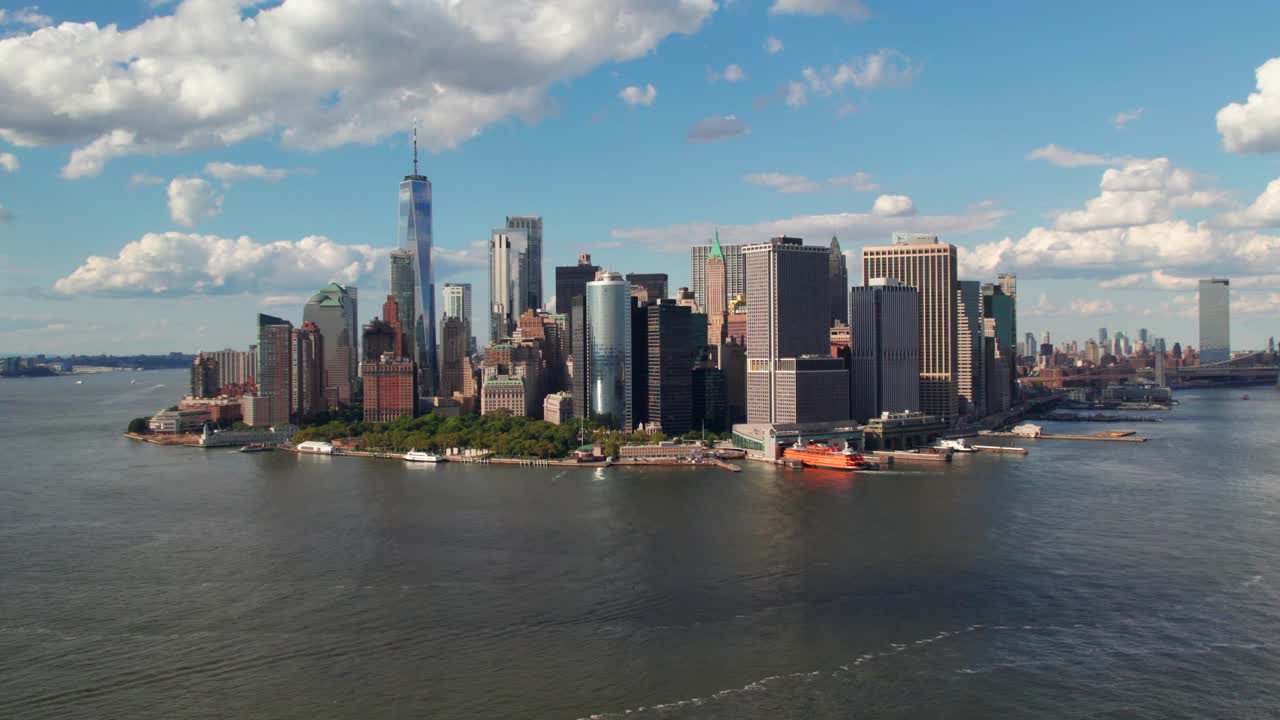 Gorgeous aerial of Manhattan's Financial District, downtown NYC skyline, warm summer colors, 4K