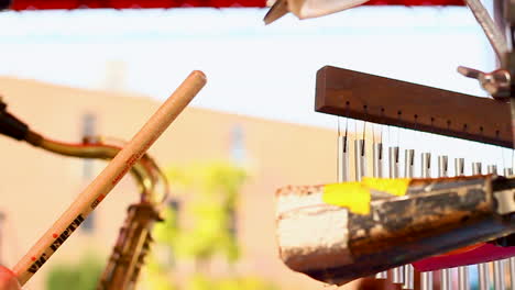 musician-playing-the-cowbell-in-slo-mo