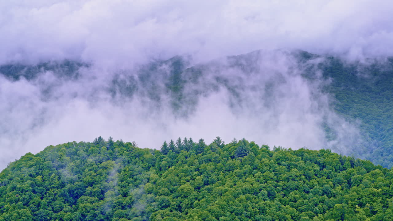Drone floats above fog-soaked peaks in the Smoky Mountains
