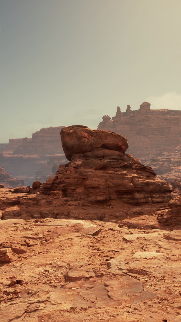 Premium stock video - A desolate desert landscape with towering red ...