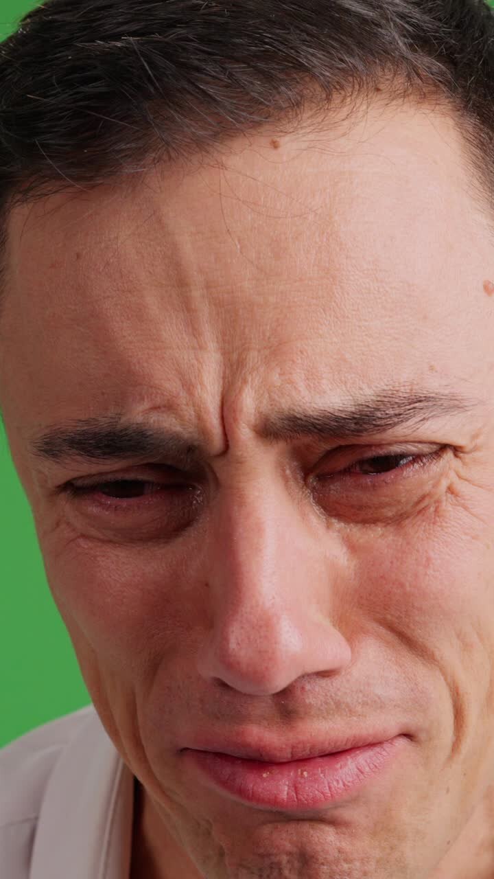 Close up of a very sad man crying
