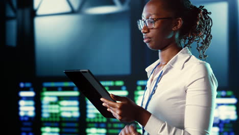 woman strolls through data center rows