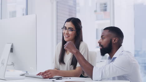 two-businesspeople-working-together-in-an-office