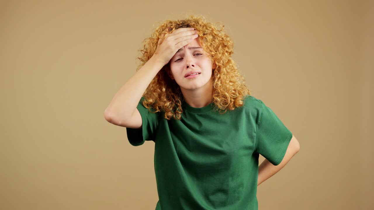 Woman suffering from headache, neck, and back pain