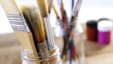 Various-paintbrush-in-glass-container