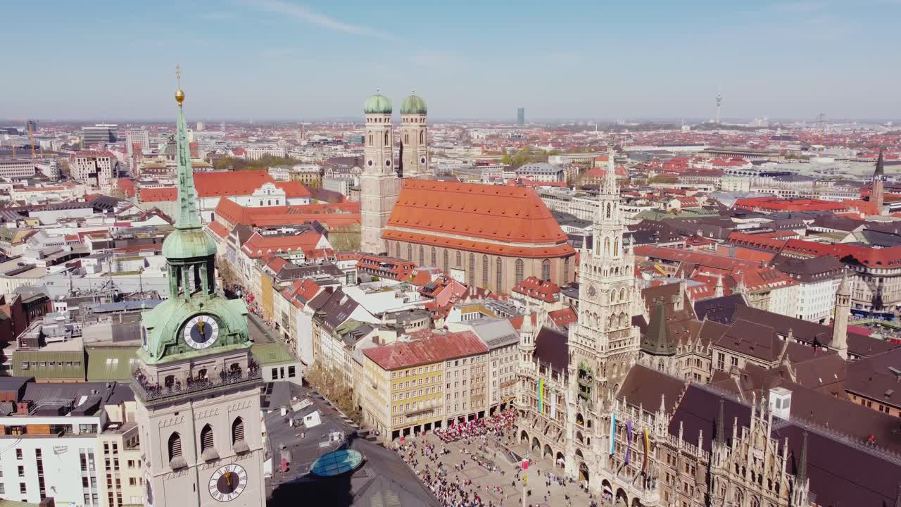 Frauenkirche, St. Peter’s Church, and the Old Town Hall in Munich, aerial drone view