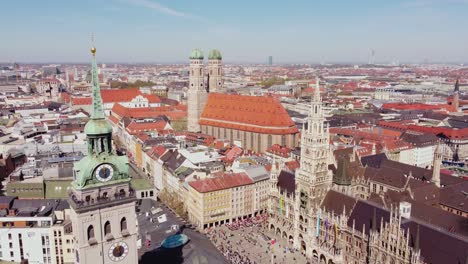 frauenkirche, st. peter’s church, and the old town hall in munich, aerial drone view