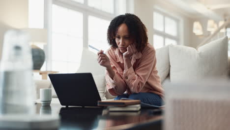 Woman working on her laptop at home
