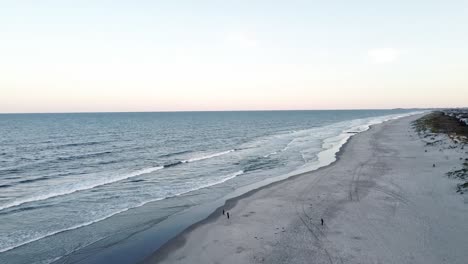 Aerial-View-Of-Ocean-Waves-Coming-Into-Sandy-Shore-Of-Beach-In-Avalon,-New-Jersey,-USA