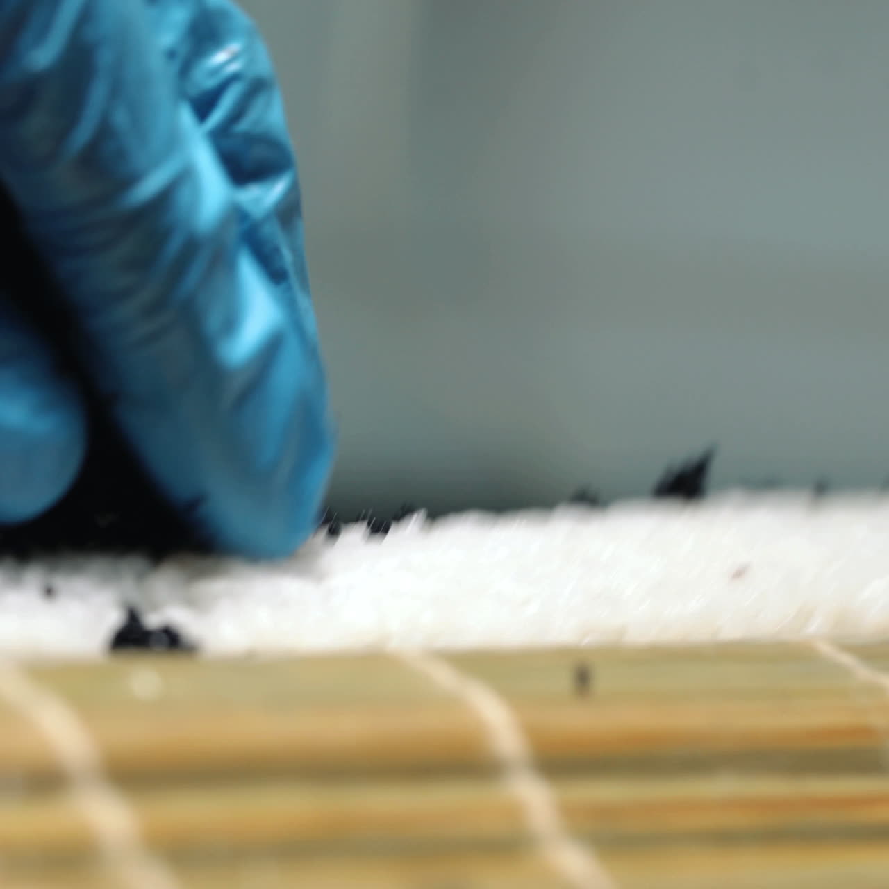 Japanese chef preparing sushi rolling. Close-up Sqare video
