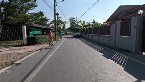 cyclist navigating through a quiet suburban area