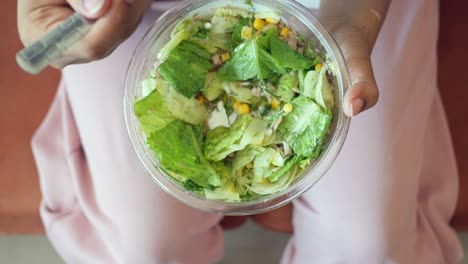 woman eating tuna salad