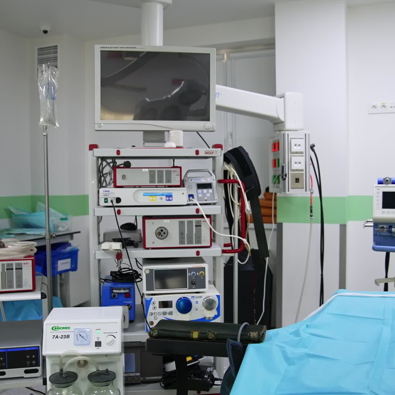 Numerous equipment filling the modern surgery room. Empty operational theatre with the switched on light