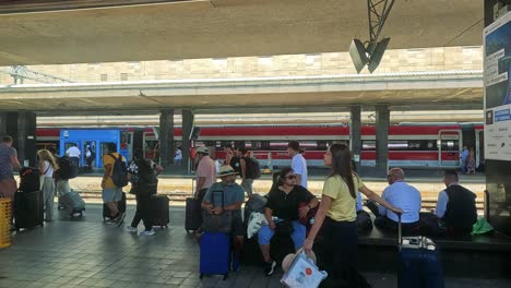 travelers waiting and moving at turin train station