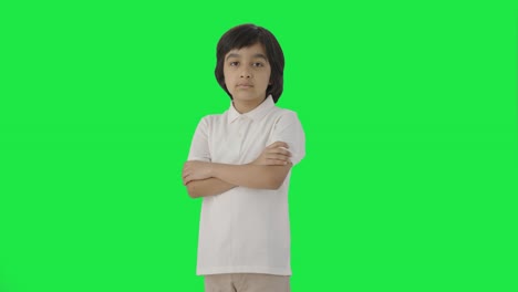 Portrait-of-Confident-Indian-boy-standing-crossed-hands-Green-screen