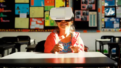 schoolgirl using virtual reality headset in classroom 4k