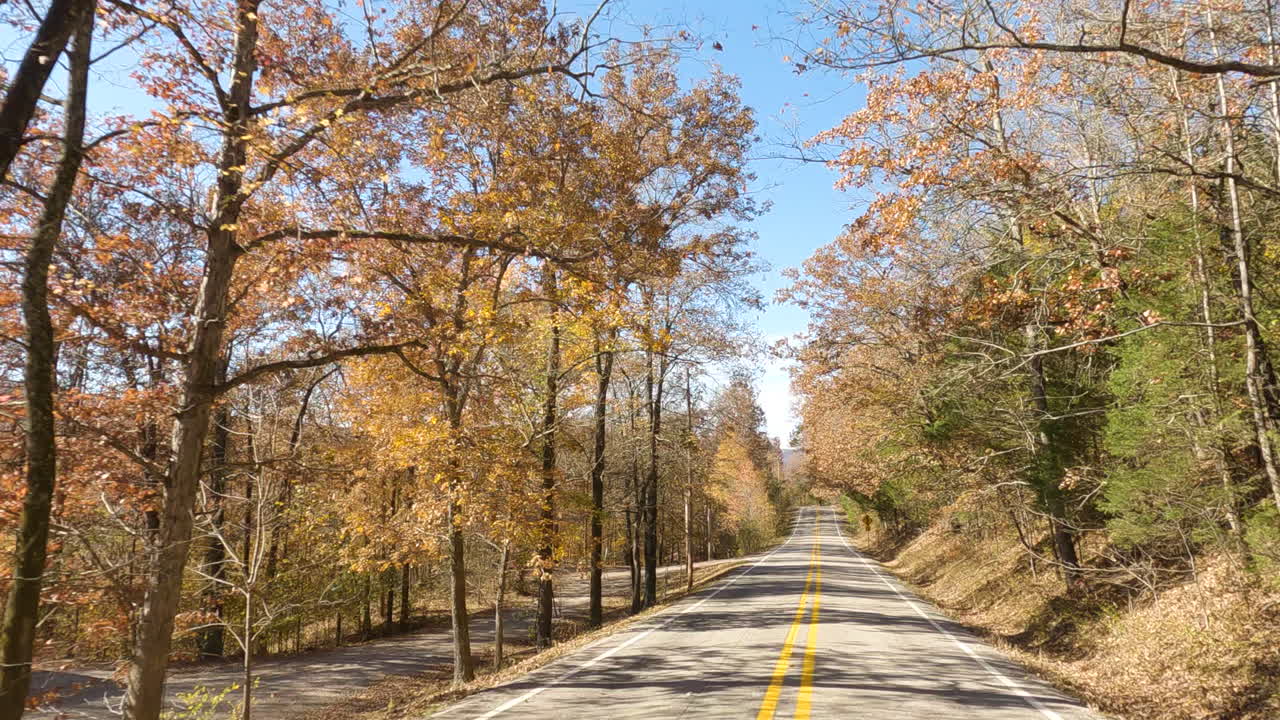 Driving Into Empty Asphalt Road During Autumn Near Devil's Den State Park, Arkansas USA
