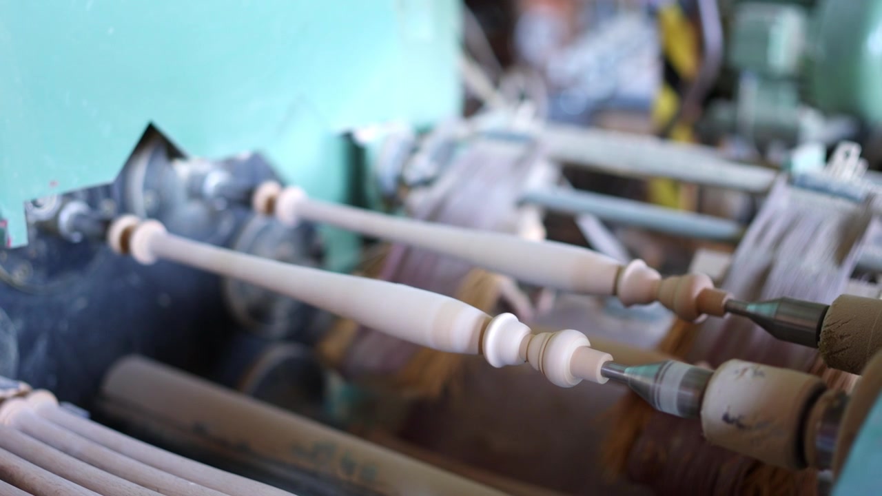 Wooden furniture leg turning on a lathe machine