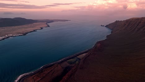 Breathtaking aerial drone footage captured at sunset from El Mirador del Río in Lanzarote, Canary Islands.