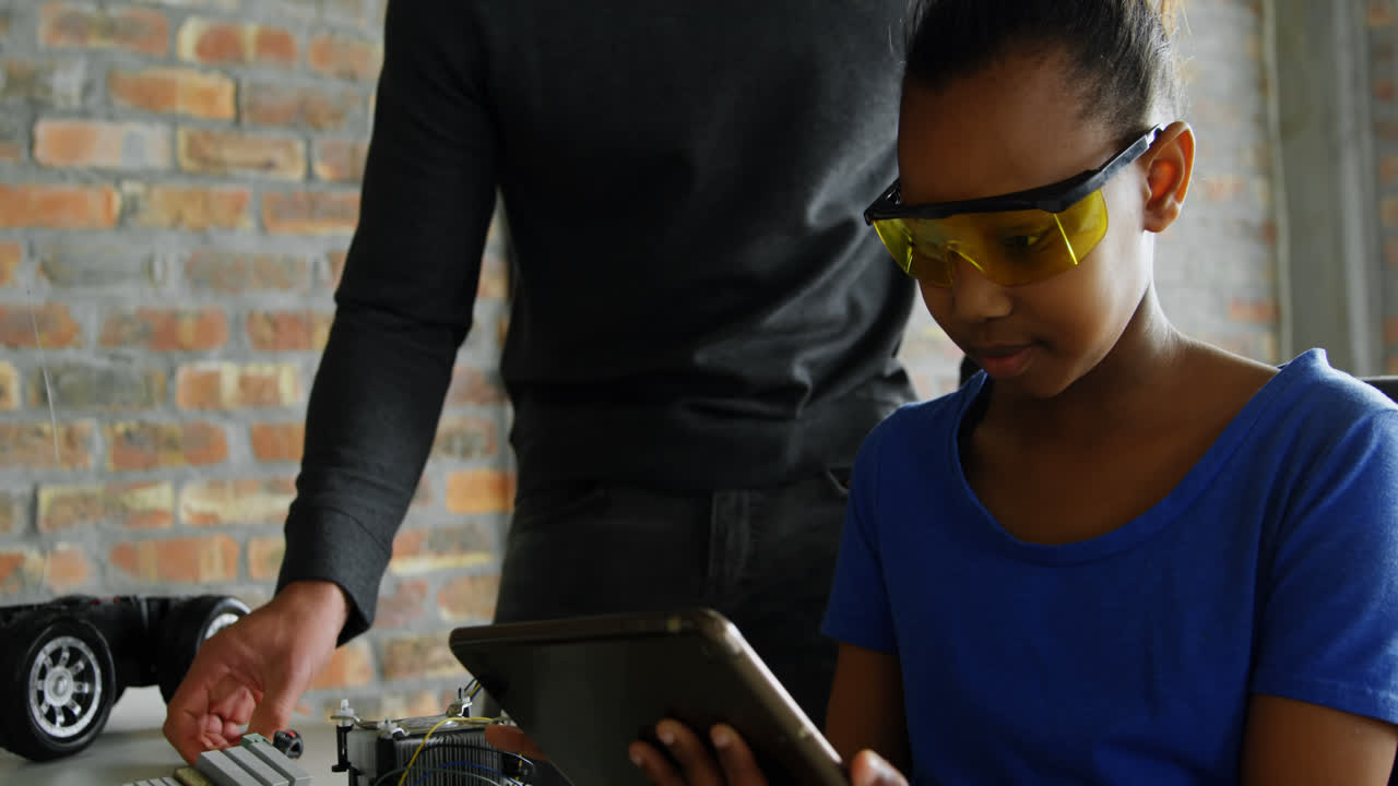 Father and daughter using digital tablet 4k