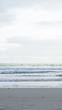 mature couple jogging on beach