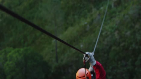 young caucasian man zip lining