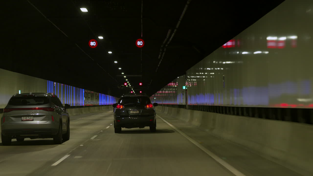 POV car Driving through a long tunnel, Sydney Australia